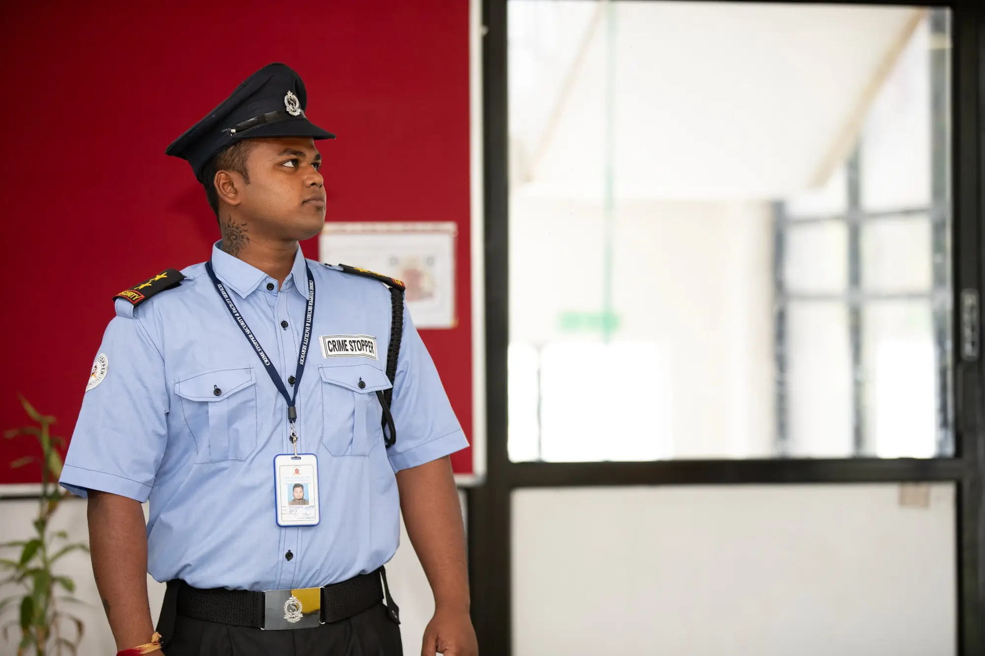 Security officer in uniform on duty at a building entrance